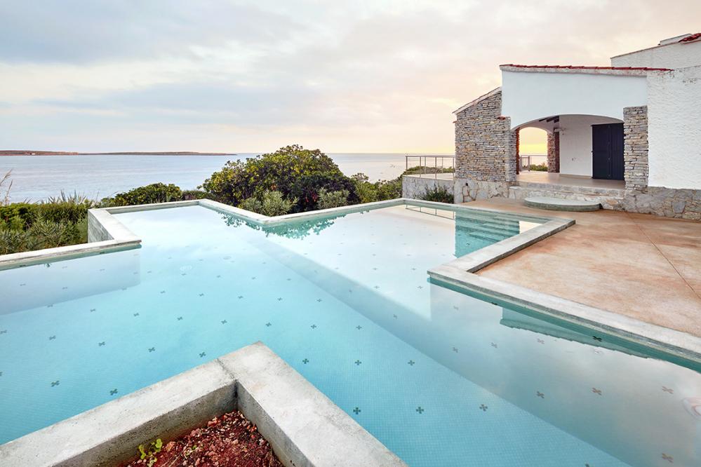 Villa Aire perched on the seafront with uninterrupted views to sea of Punta Prima.