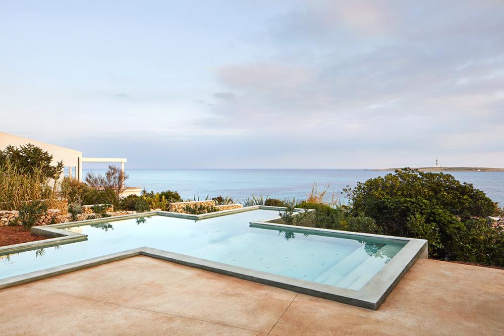 Villa Aire perched on the seafront with uninterrupted views to sea of Punta Prima.