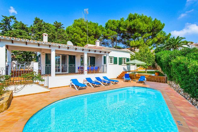 Charming villa is located in Binibèquer, Menorca  and overlooking the beach.